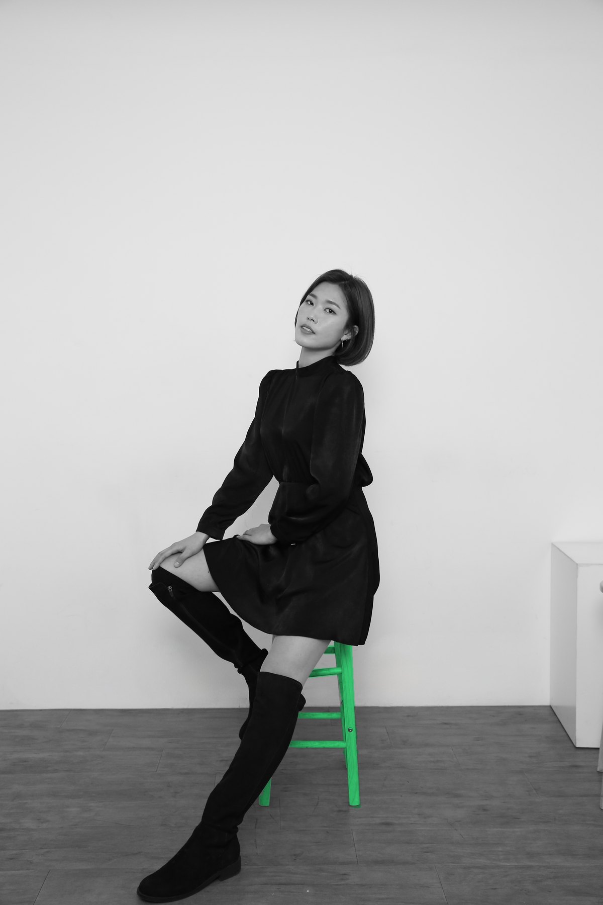 Black-and-white portrait of Haneul Lee, seated